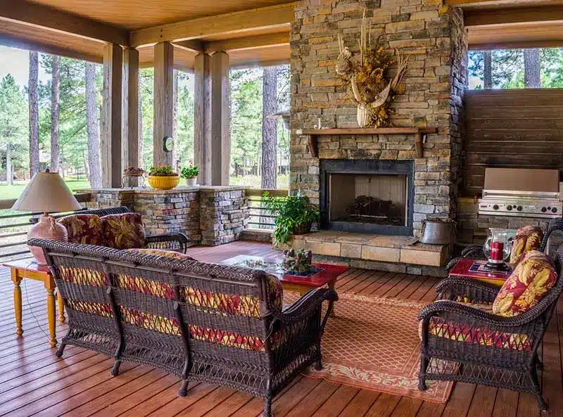 A living room with a fireplace and many chairs