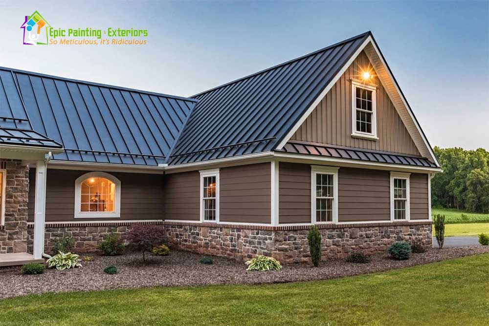 A house with a blue metal roof and stone siding.