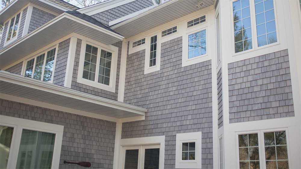 A house with two windows and a door.